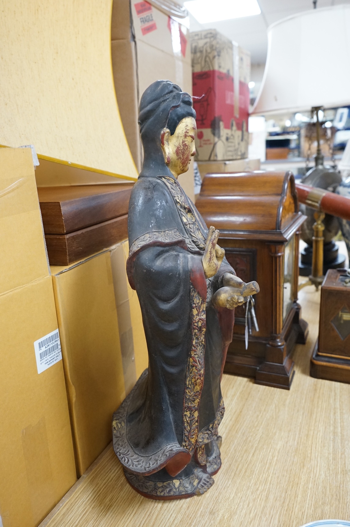 A Chinese partially gilt papier-mâché figure of Guanyin, 63cm high